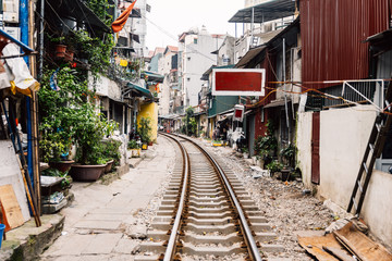 Fototapeta na wymiar Vietnamese train railway with village all along the way at Hanoi, Vietnam.