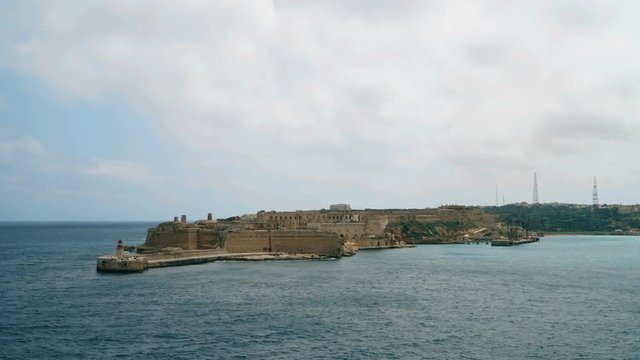 Timelapse View of the Mediterranean Sea, Fort Ricasoli and the island of Malta from the coast of Valletta.