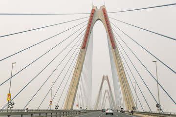 Obraz premium Nhat Tan suspension bridge that view from moving car from below in Hanoi, Vietnam.