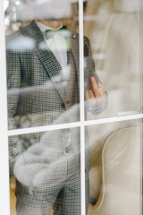 a man in a suit shows an indecent gesture fuck you