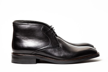 Obraz na płótnie Canvas Black leather male shoes, white background