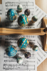 decorative copy Faberge eggs on the notes next to the mirror