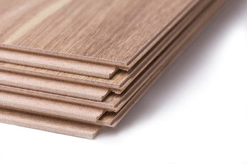Four laminate boards stacked one on one isolated on a white background
