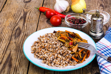 Vegetarian dish. Grain porridge with stewed vegetables