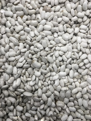 Fototapeta na wymiar Heap of white beans texture as background. Top view.
