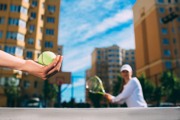 female hand holding tennis ball, prepare to serve. tennis players starting set