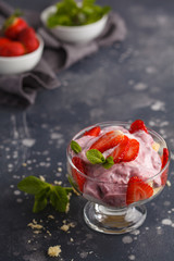 Strawberry dessert. English berry trifle, cheesecake, parfait. Berry mousse in glass on a dark background, copy space