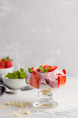 Strawberry dessert. English berry trifle, cheesecake, parfait. Berry mousse in glass on a light background.