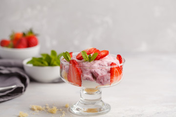 Strawberry dessert. English berry trifle, cheesecake, parfait. Berry mousse in glass on a light background.