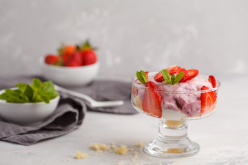 Strawberry dessert. English berry trifle, cheesecake, parfait. Berry mousse in glass on a light background.