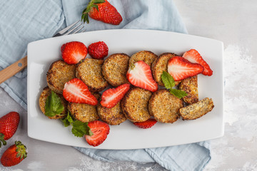 Vegan sweet tofu fritters with strawberries, top view. Healthy vegan food concept.