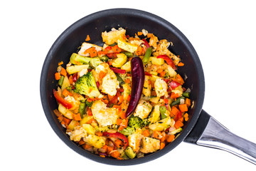 Stewed vegetables with chicken fillet pieces in breading