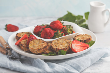 Vegan breakfast sweet tofu fritters (pancakes) with strawberries. Healthy vegan food concept.