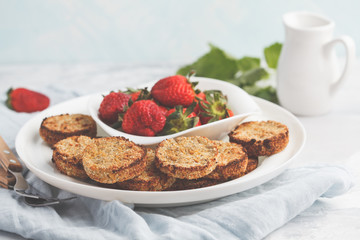 Vegan breakfast sweet tofu fritters (pancakes) with strawberries. Healthy vegan food concept.