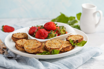 Vegan breakfast sweet tofu fritters (pancakes) with strawberries. Healthy vegan food concept.
