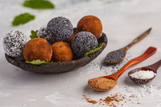 Homemade Healthy vegan Raw Energy Balls with carob, a poppy and coconut. Healthy vegan food concept.