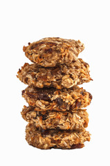 Vegan oatmeal cookies with dates and a banana isolated on white background.