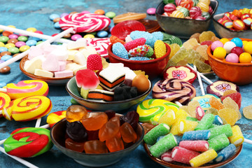 Fototapeta na wymiar candies with jelly and sugar. colorful array of different childs sweets and treats.