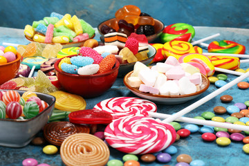 candies with jelly and sugar. colorful array of different childs sweets and treats.