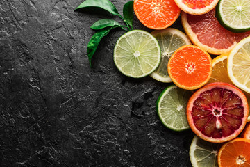 Mix of different citrus fruits closeup. Healthy diet vitamin concept. Food photography - obrazy, fototapety, plakaty