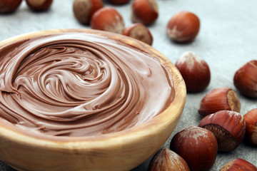 Homemade hazelnut spread in wooden bowl. Hazelnut Nougat cream