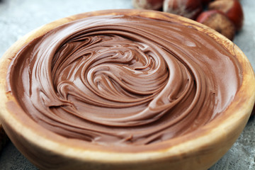 Homemade hazelnut spread in wooden bowl. Hazelnut Nougat cream