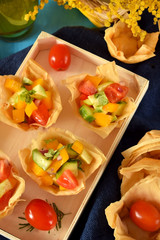 Vegetable salad served in filo tartlets. Top view