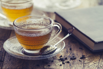Cup of green tea on a vintage rustic wood blurry or bokeh background