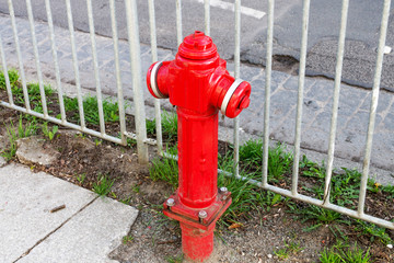 Red old fire hydrant near the road