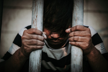 Hands of men desperate to catch the iron prison,prisoner concept,thailand people,Hope to be...
