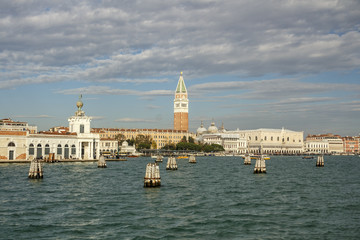 Fototapeta na wymiar Seaside view on St Mark's Campanile (Bell Tower) in Venice, Italy, 2016