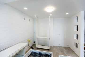 Custom kitchen cabinets in various stages of installation base for island in center