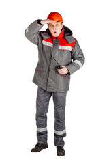 Male builder over white wall background. repair, construction, building, people and maintenance concept.