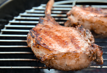 Cooking of appetizing juicy spare ribs outdoors