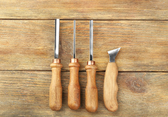 Set of carpenter's tools on wooden background