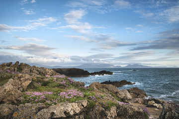 Landscape view of Snowdonia mountain range from Angelsey at sunset