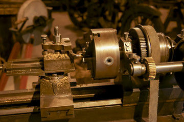 Hundred years old lathe, a part of car service.