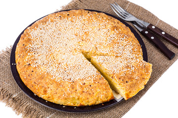 Homemade cake with cheese, sprinkled with sesame seeds