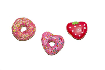 Strawberry glazed donuts isolated on a white background. Top view.