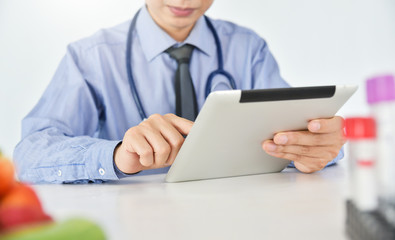 Fototapeta premium Young Asian male doctor is working.