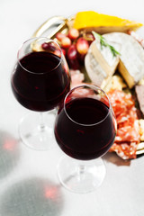 Red wine and charcuterie assortment on the board