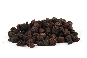 Dry bilberry (Vaccinium myrtillus) fruits isolated on white.