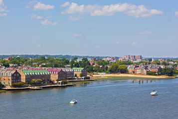 A panoramic view on Old Town Alexandria from the Potomac River, Virginia, USA. A river waterfront of nationally designated historic district in early fall.