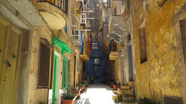 Walking along the medieval streets of Valletta, Malta.