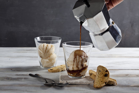 Espresso is pouring into ice cream cup.