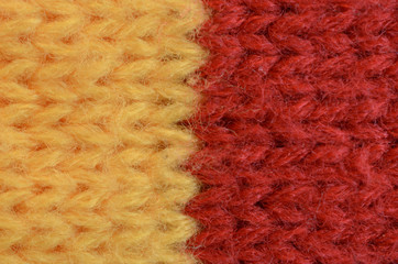 Textile texture of wool yellow and red colors.