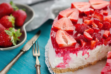 Dessert strawberry cake with fork and knife
