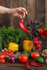 vegetables - a set of ingredients for salad (tomato, cucumber, radish, pepper, arugula, basil, parsley, dill, herbs, herbs, radish and others)