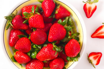Close Up of Fresh Organic Strawberries from Overhead in a Bowl