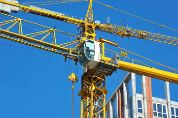 Crane and highrise construction site